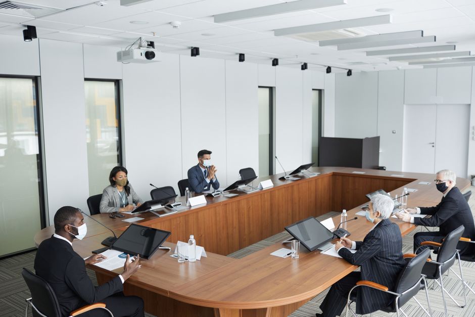 Corporate financial executives reviewing income statement line item captions