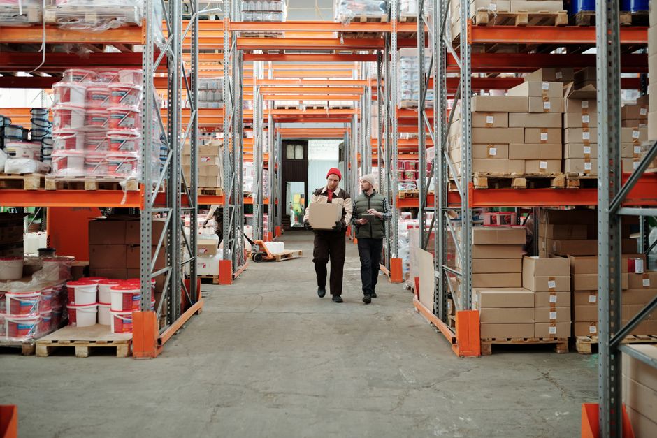 A modern distribution warehouse with inventory pallets representing purchases of inventory