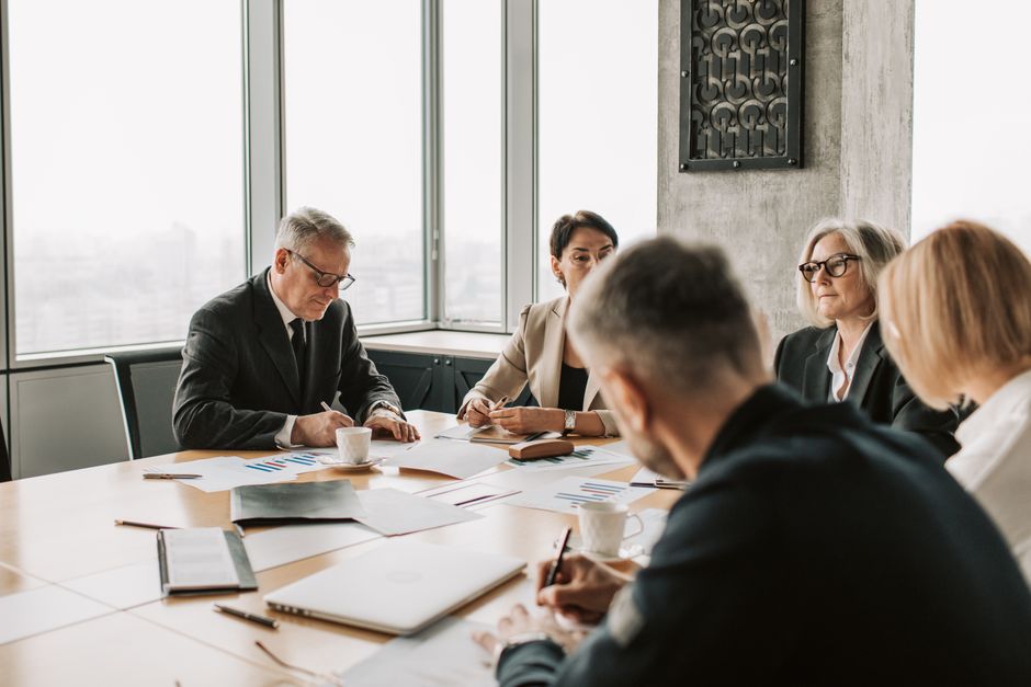 Corporate executives discussing early adoption strategy for accounting standards
