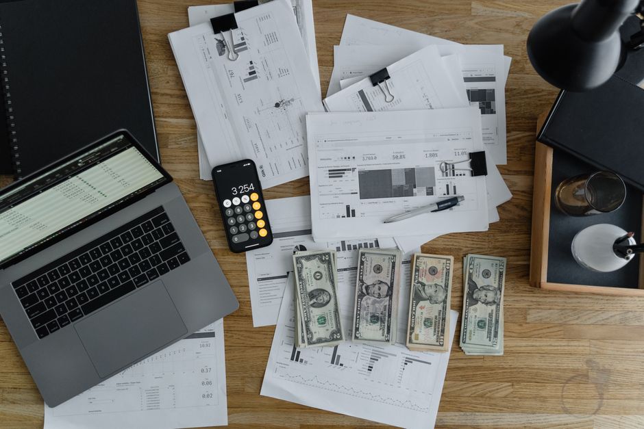 Accountant reviewing quarterly interim financial statements on a laptop